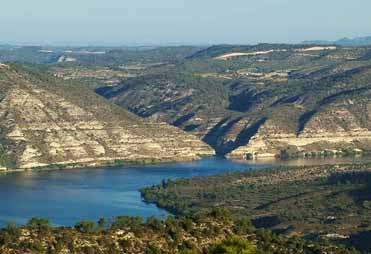 A distant view of part of the old village of Faió half emerged in the River Ebro